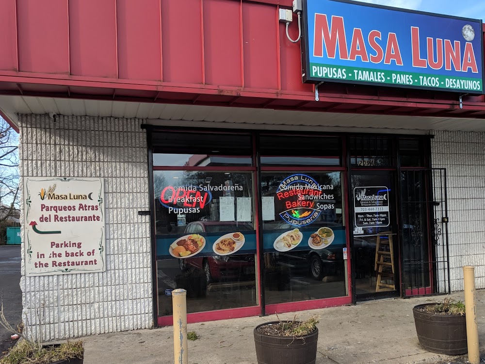 Masa Luna's storefront on E Holly Ave with its red awning and hand-painted sign